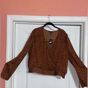 NWT Express woman’s blouse in sz xl. Waist is stretchy for better comfort.